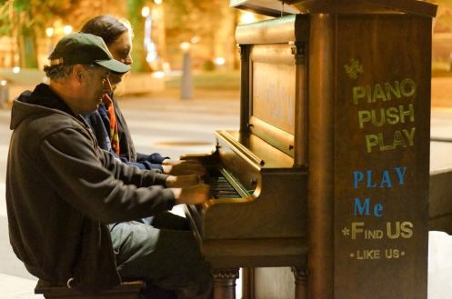 Two strangers meet and share songs at the Portland Art Museum. Photo by Benji Vurong.
