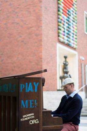 unknown individual plays the piano on site at the Portland Art Museum