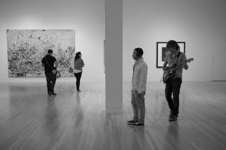 Machine Project’s Live Museum Soundtrack at the Hammer Museum. Guitarist Eric Klerks improvises music for each artworks this visitor views.