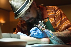 Museum visitors receive tatoos based on works of art in the Portland Art Museum's collection as part of a Shine a Light project by artist Jason Sturgill.