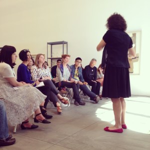 Liz Diament leading part of a gallery teaching experience with Ai Weiwei's "Marble Chair."
