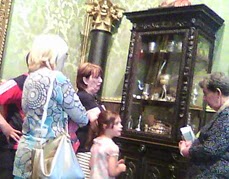 talking with volunter and elbow of hanger-on