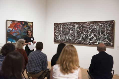 Molleen Theodore, Associate Curator of Programs, leads staff in a listening and looking exercise in front of Jackson Pollock’s Arabesque (number 13a.)
